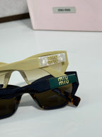 Olive and black sunglasses close-up with branded temple and logo case