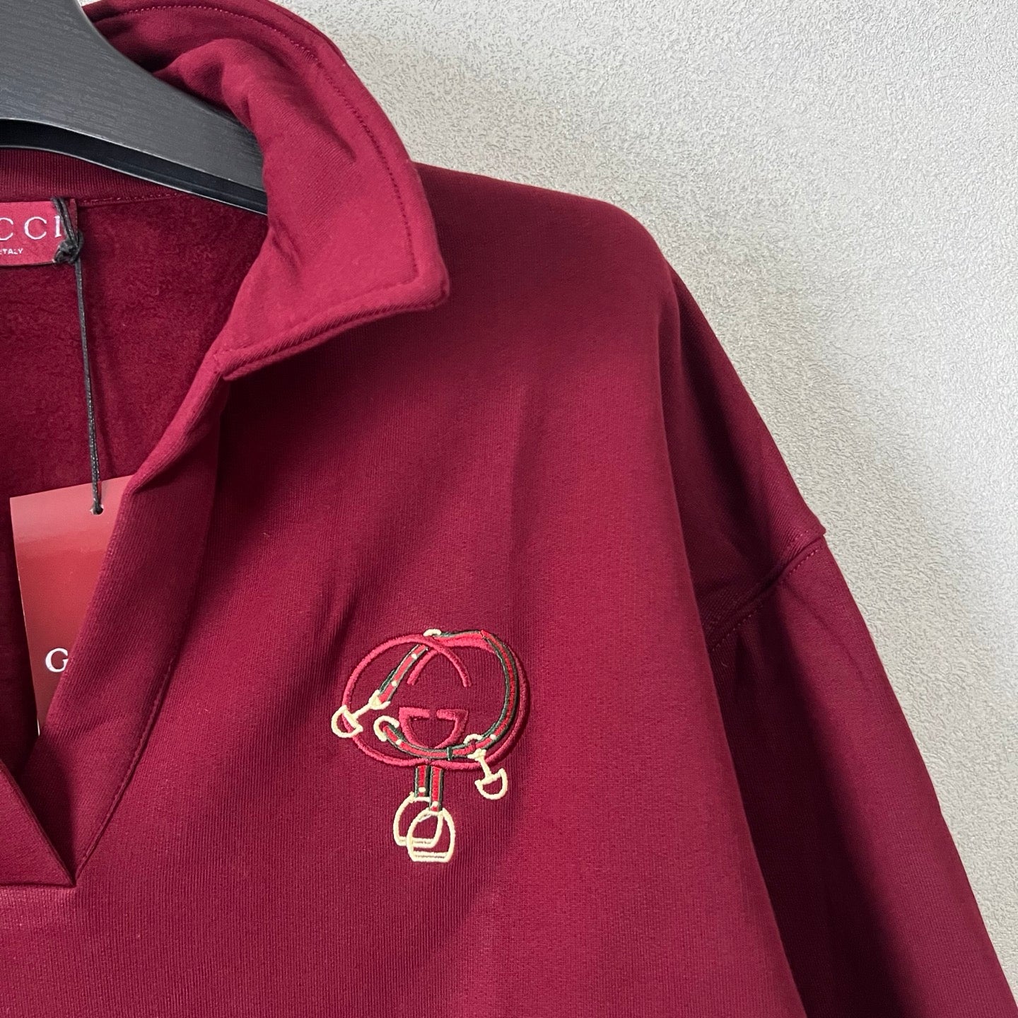Gucci maroon sweatshirt with embroidered crest at chest and half-zip placket