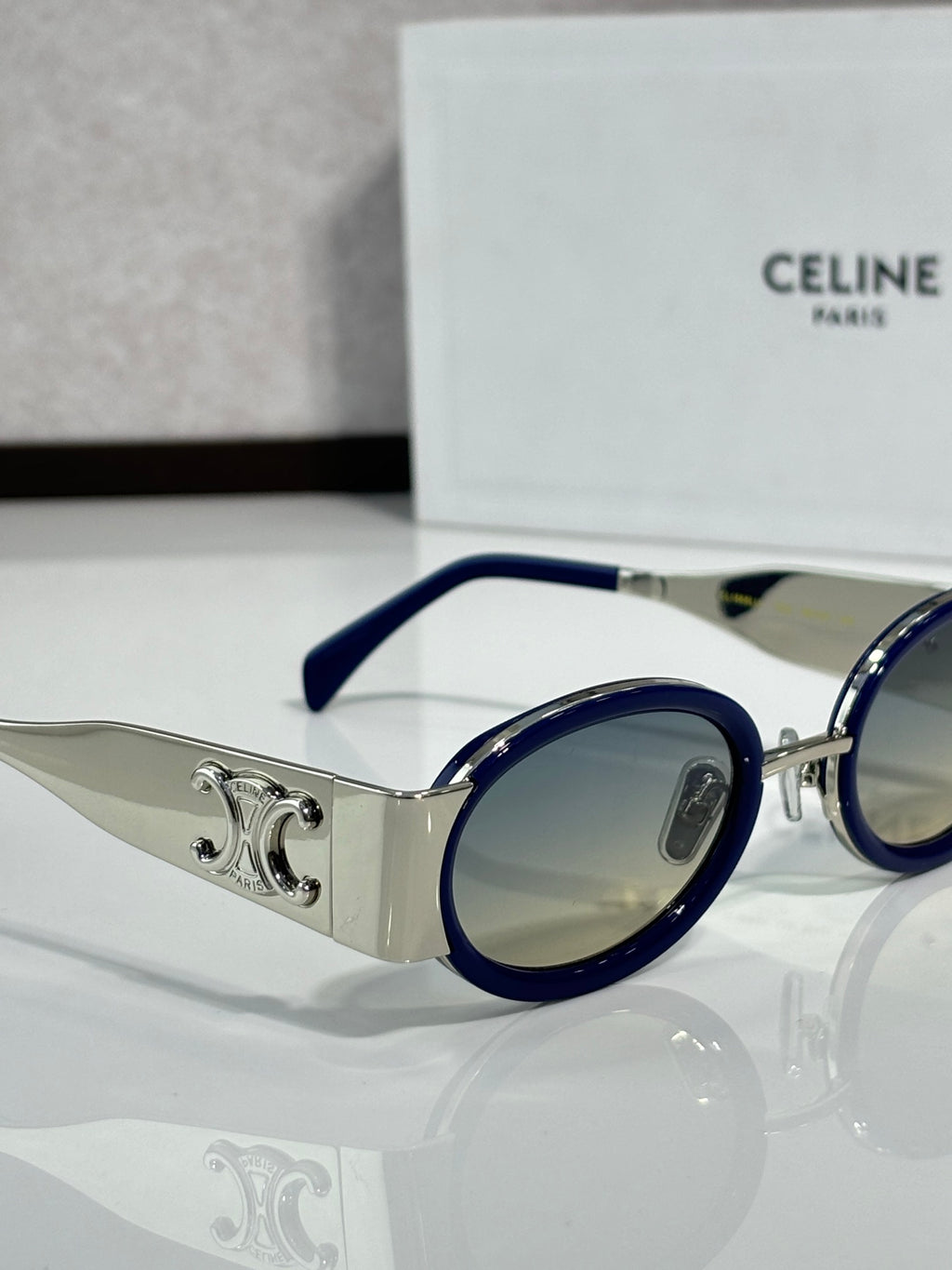 Celine blue round glasses with silver temple detail and light-tinted lens