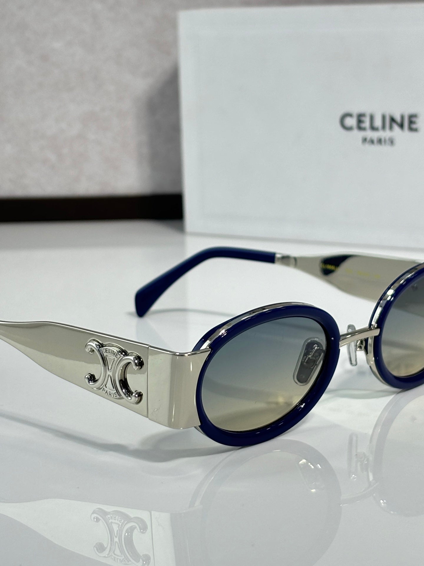 Celine blue round glasses with silver temple detail and light-tinted lens