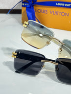 Louis Vuitton sunglasses pair with gold-tone details and tinted lenses