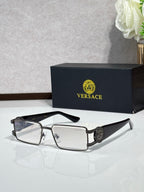 Silver-tone rectangular eyeglasses with clear lenses and logo medallion on the temple