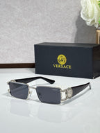 Silver-tone rectangular sunglasses with dark lenses and logo medallion on the temple