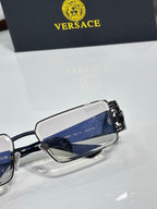 Rectangular eyeglasses with dark blue lens detail and black temple with logo hardware