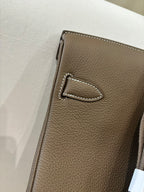 Hermes bag taupe leather with top stitched pocket flap detail and contrast edge stitching