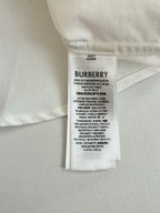 Burberry size and care label on a white long-sleeve shirt