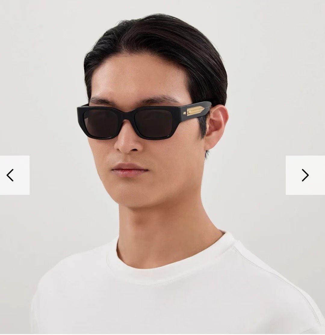 Bottega Veneta sunglasses on a model, black frames with dark lenses