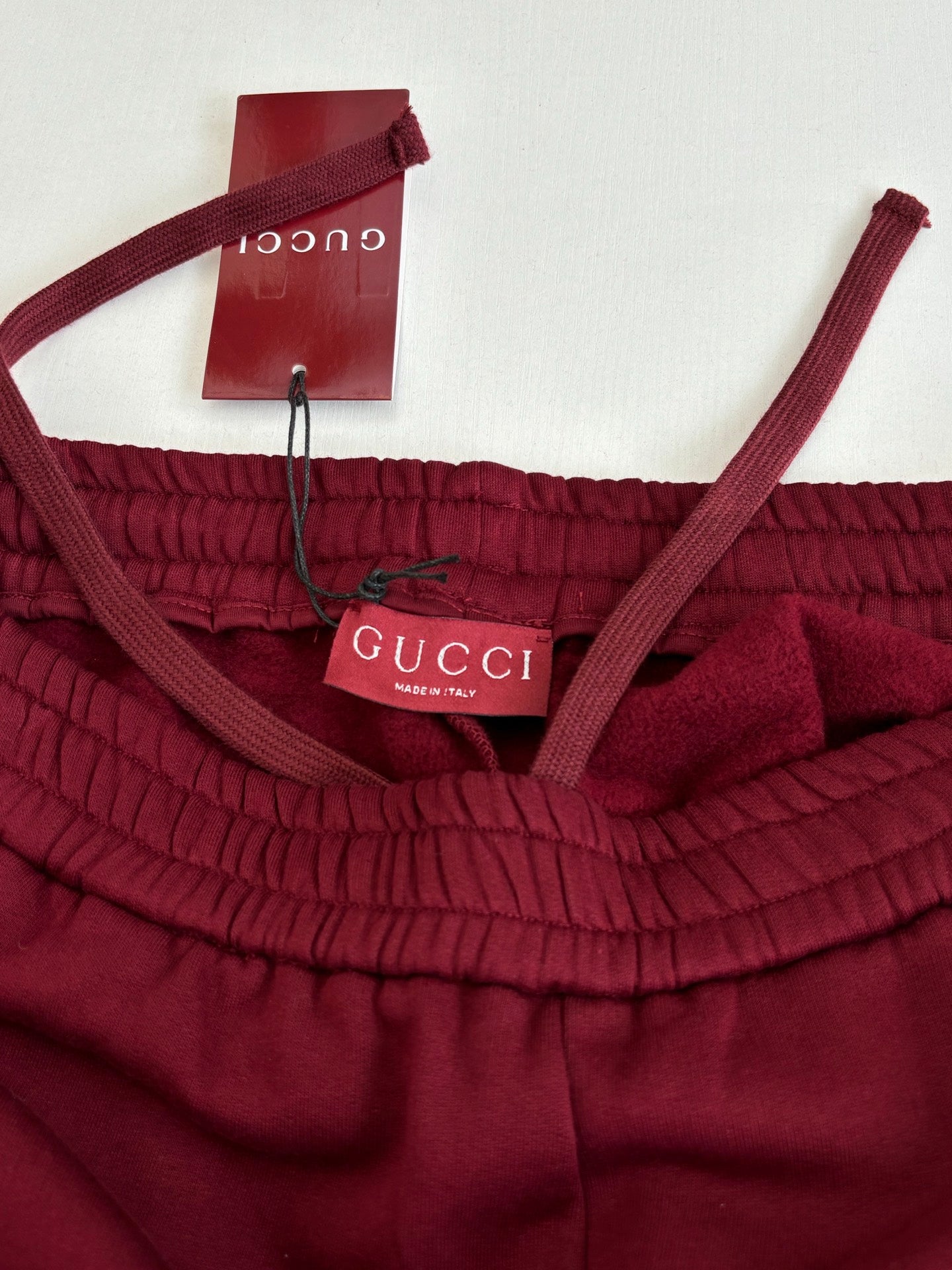 Gucci pants waistband with interior Gucci label and drawstring