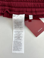 Gucci pants fabric care label and size tag inside waistband