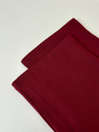 Burgundy pants with folded leg hem
