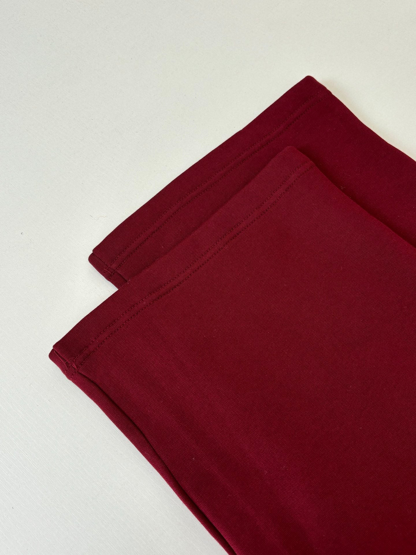 Burgundy pants with folded leg hem