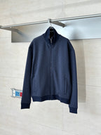 Navy Gucci zip-up jacket with high collar and ribbed cuffs
