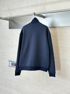 Back view of navy Gucci zip-up jacket with high collar