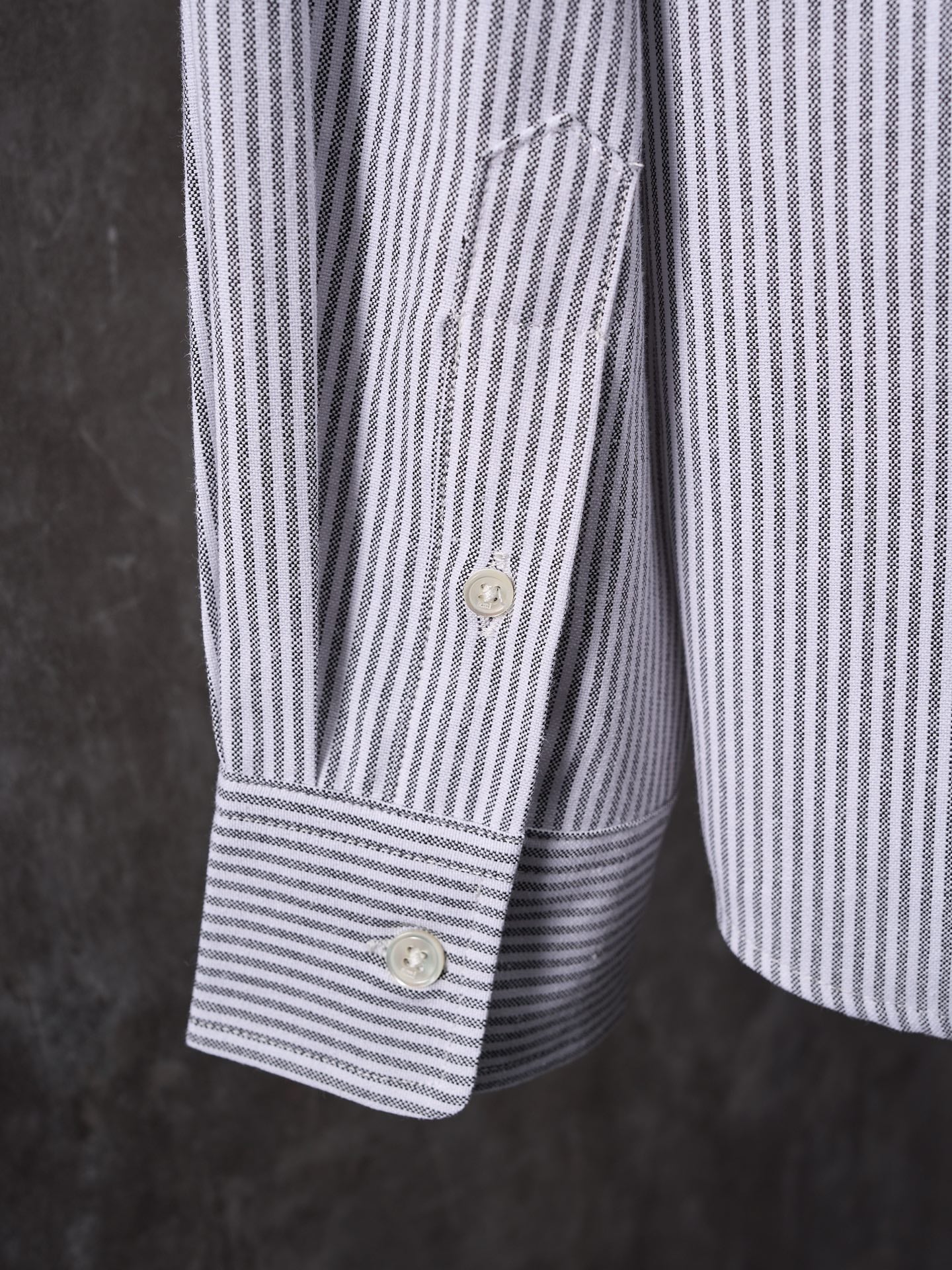 Striped button-up sleeve with buttoned cuff