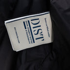 Long puffer jacket inner label with blue text and 'Down Certified' logo.