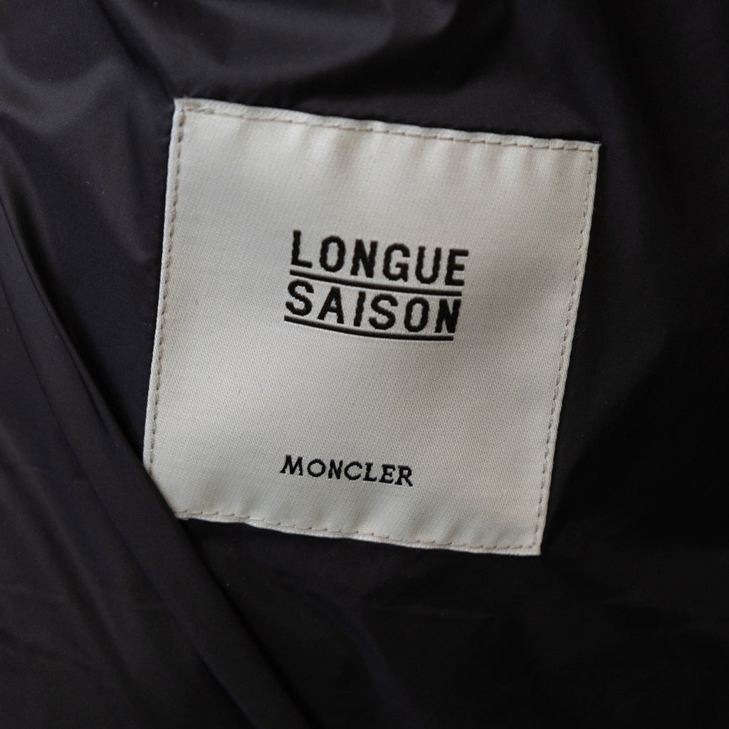 Long puffer jacket label reading 'LONGUE SAISON' with Moncler branding.