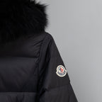 Moncler long puffer coat sleeve patch and dark puffer fabric