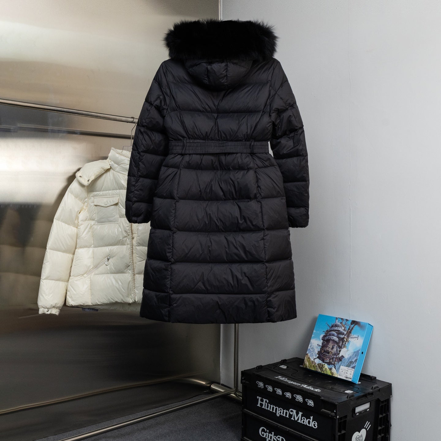 Moncler long puffer coat with belted waist and faux fur hood, dark color