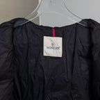 Moncler long puffer coat neckline label with contrast trim, dark fabric