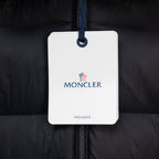 Moncler garment tag on long puffer coat zipper, dark fabric