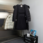 Moncler long puffer coat with faux fur hood and front zip, dark color