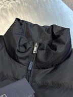 Prada dark puffer jacket neck zipper and collar detail with fabric tag