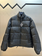 Prada dark puffer jacket with full front zipper and stand collar