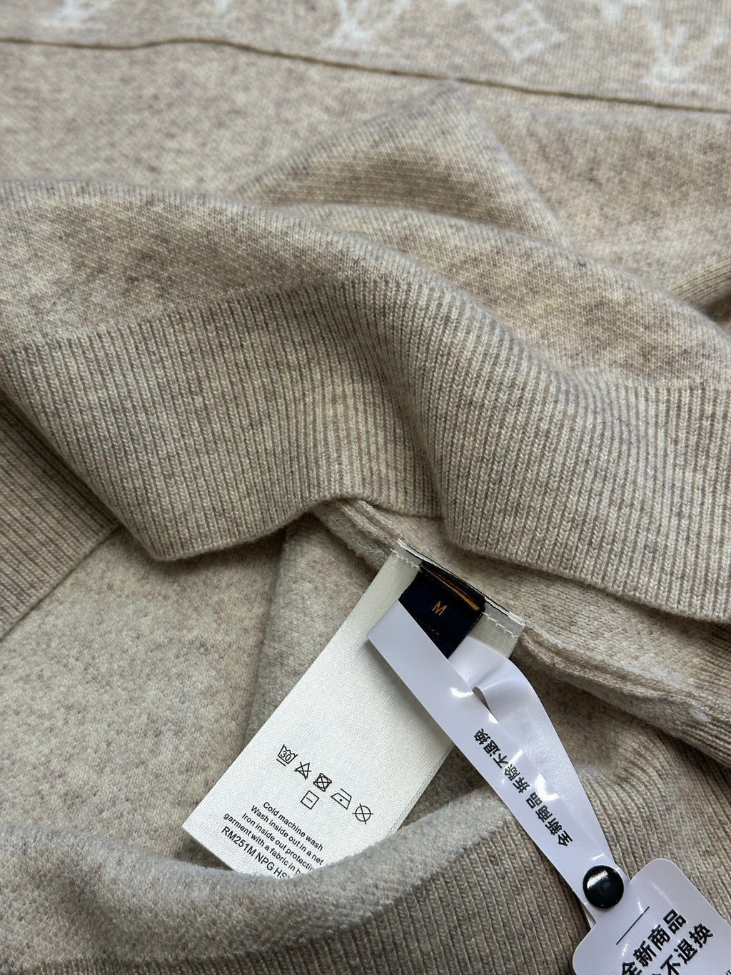 Louis Vuitton sweater fabric with care tag and ribbed collar trim