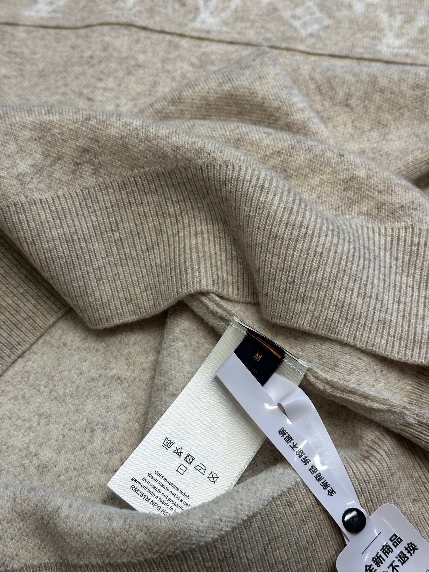 Louis Vuitton sweater fabric with care tag and ribbed collar trim