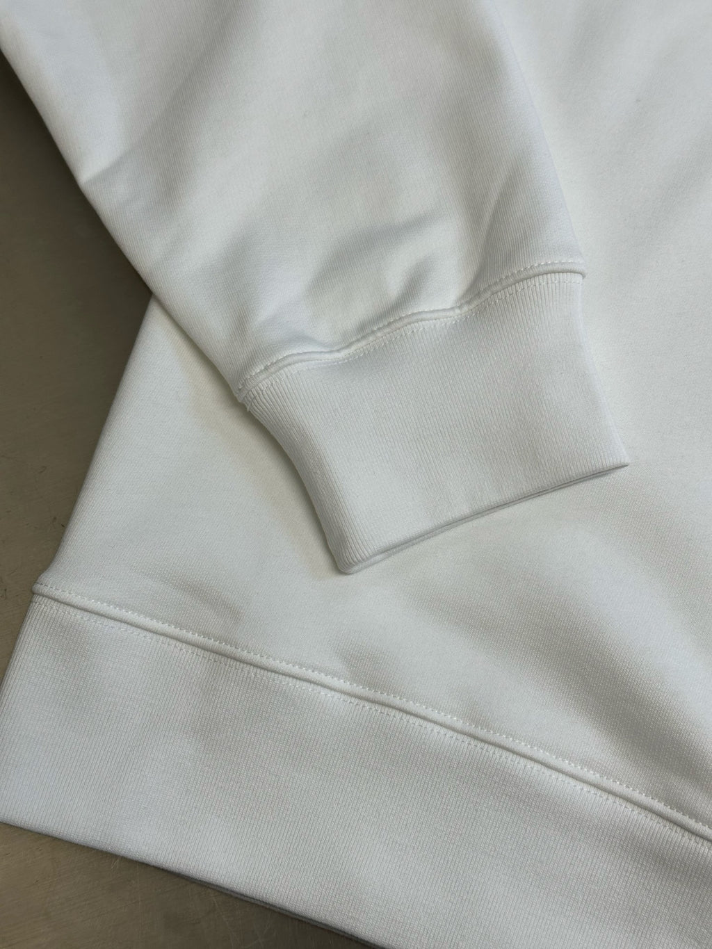 White Gucci sweatshirt sleeve cuff and hem seam detail
