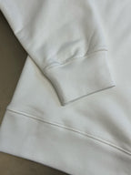 White Gucci sweatshirt sleeve cuff and hem seam detail