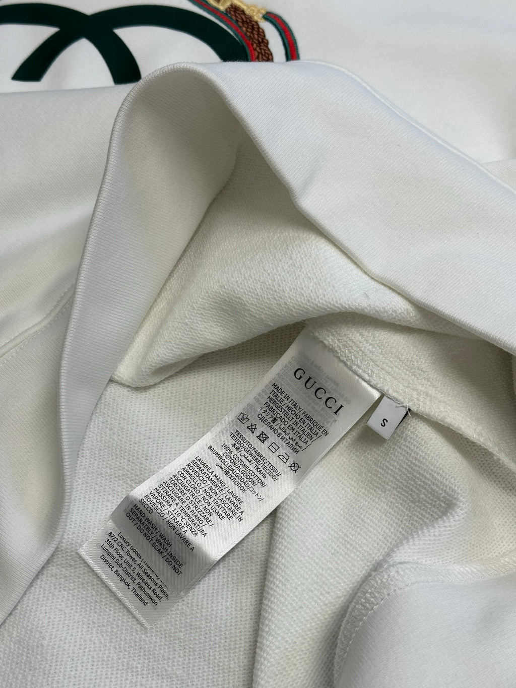 White Gucci sweatshirt interior with care label and size tag