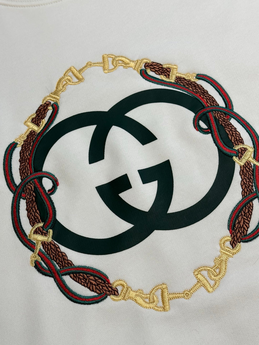 White Gucci sweatshirt with embroidered circular logo detail