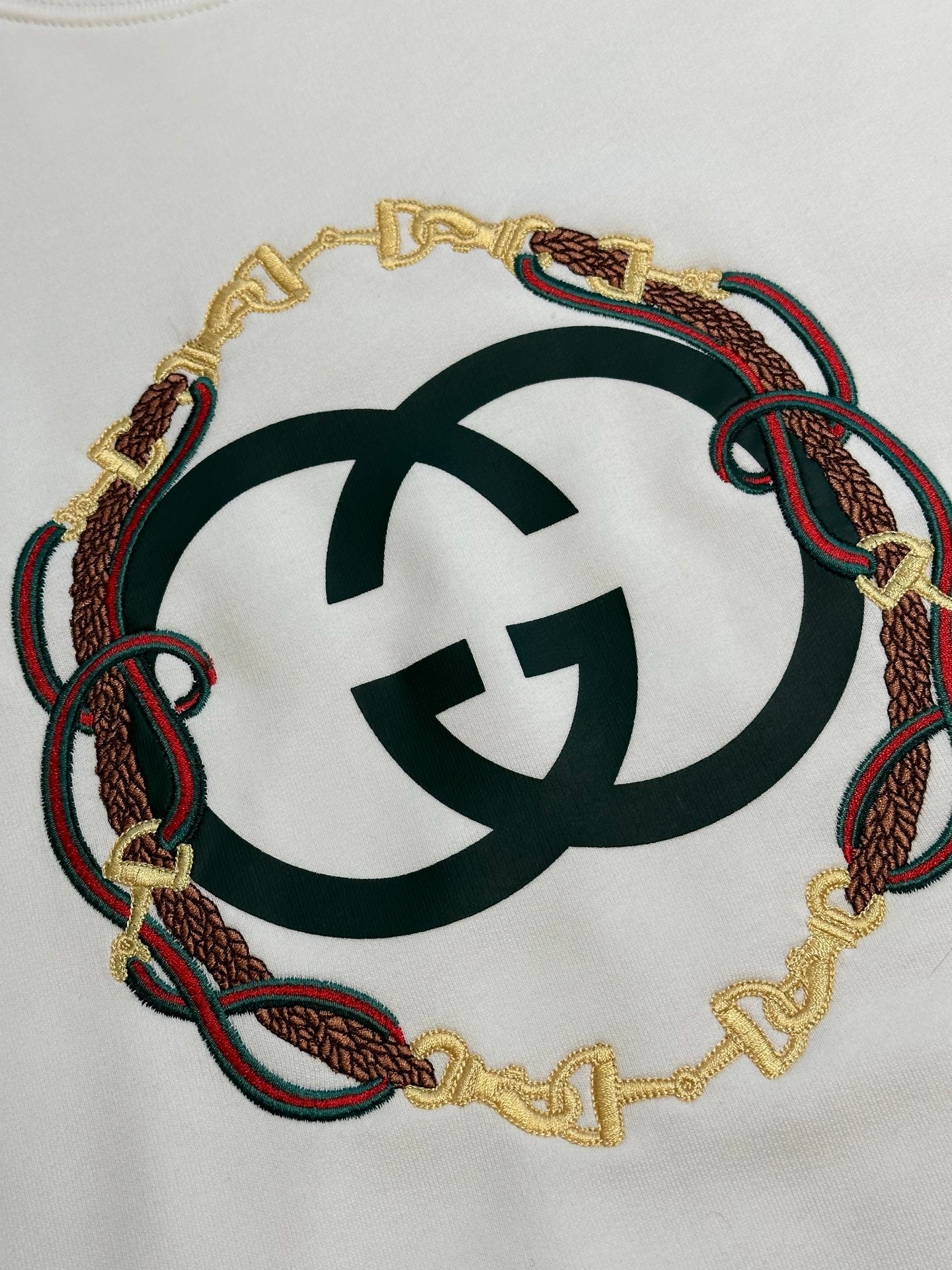 White Gucci sweatshirt with embroidered circular logo detail