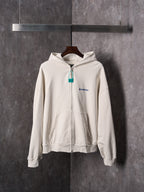 Off-white zip-up hoodie with hood, front pocket and Balenciaga chest logo