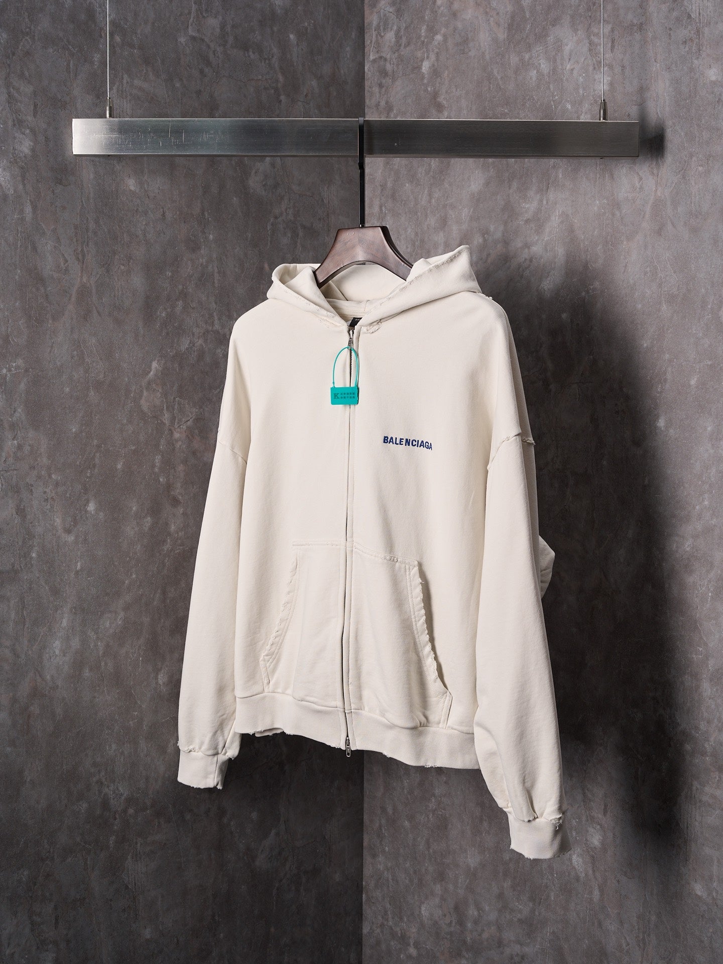 Off-white zip-up hoodie with hood, front zipper and Balenciaga logo detail