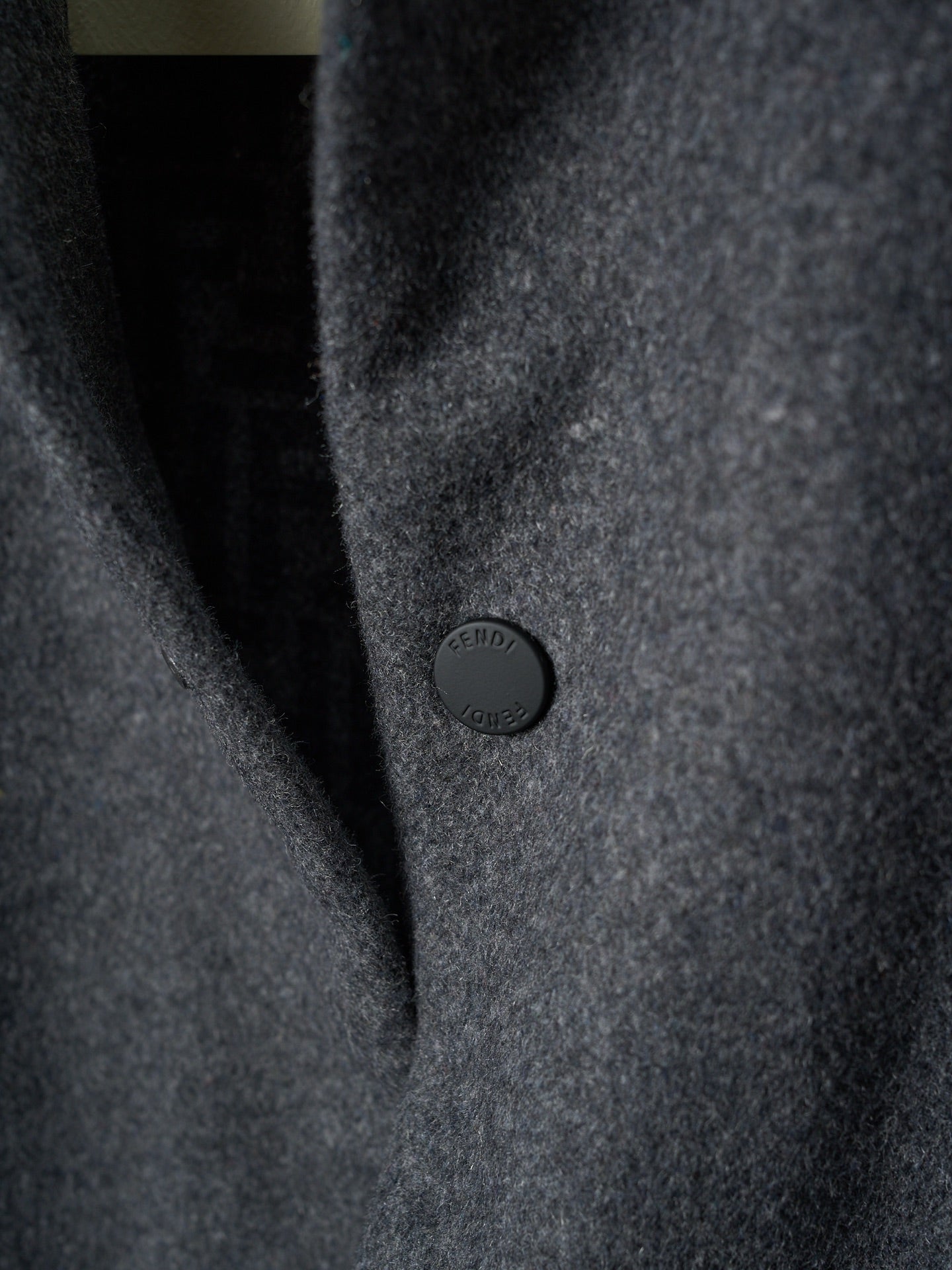 Fendi long coat sleeve detail, dark gray fabric and round button