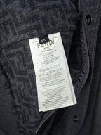 Long dark Fendi garment care label tag on inner placket
