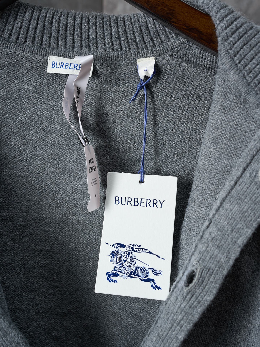 Burberry cardigan knit collar with button placket; hang tag shows Burberry logo