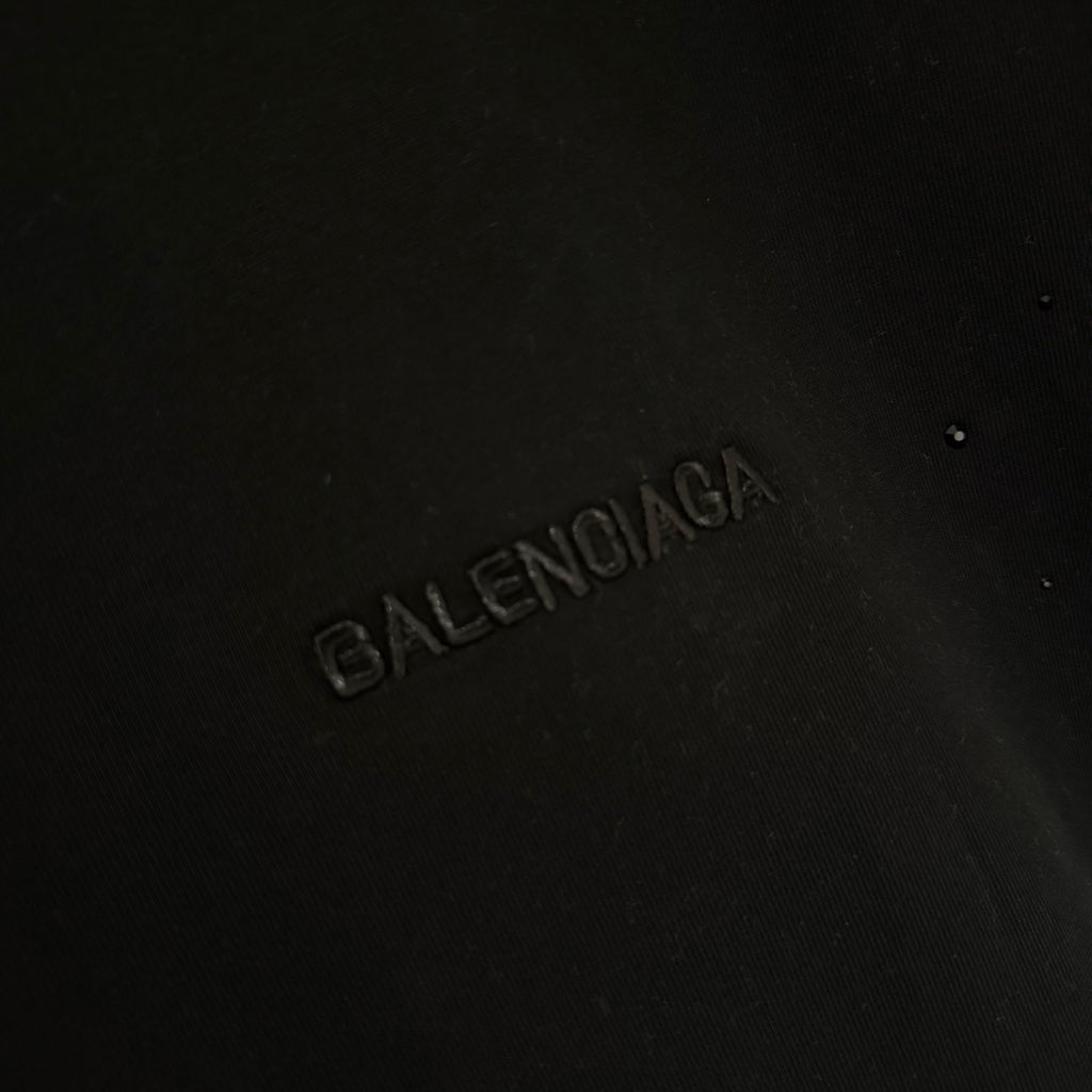 Balenciaga black T-shirt with raised Balenciaga logo on the chest
