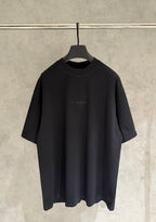 Balenciaga black crewneck T-shirt with small chest logo and scattered stud details