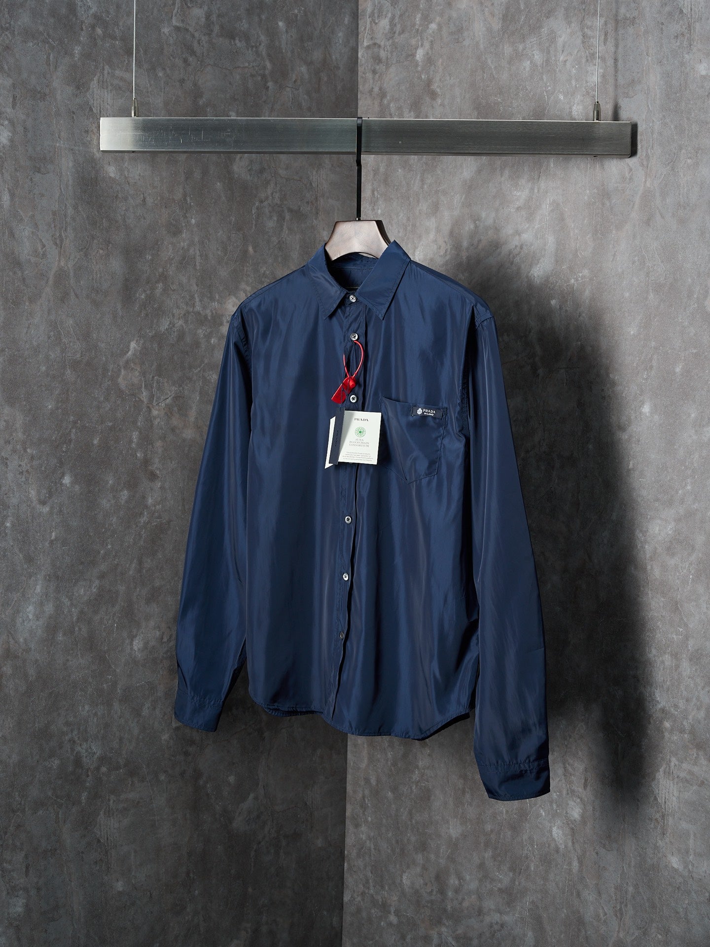 Navy Prada long-sleeve shirt with point collar and button front, product tags attached
