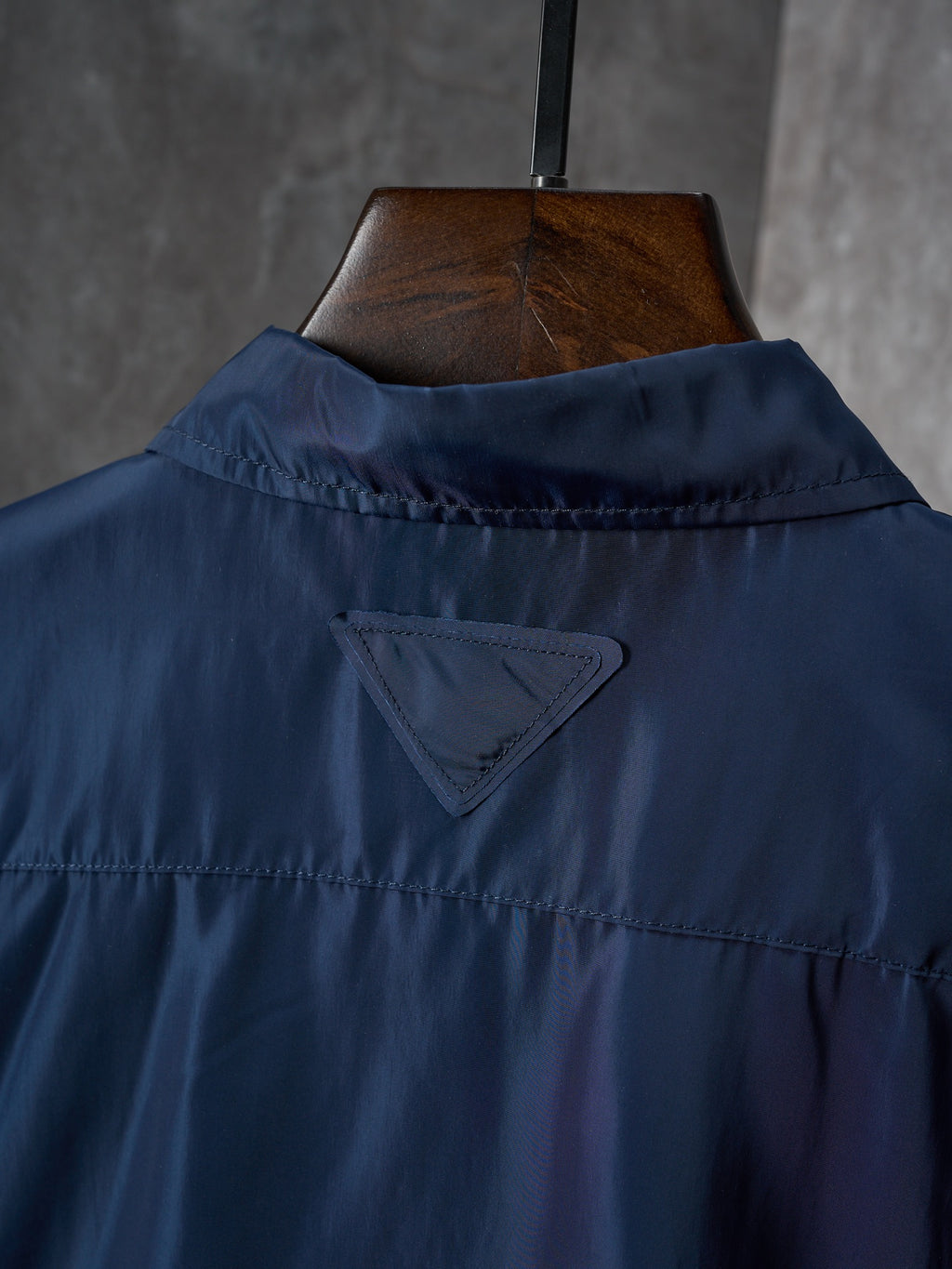 Navy Prada shirt collar and upper back panel with triangular logo patch