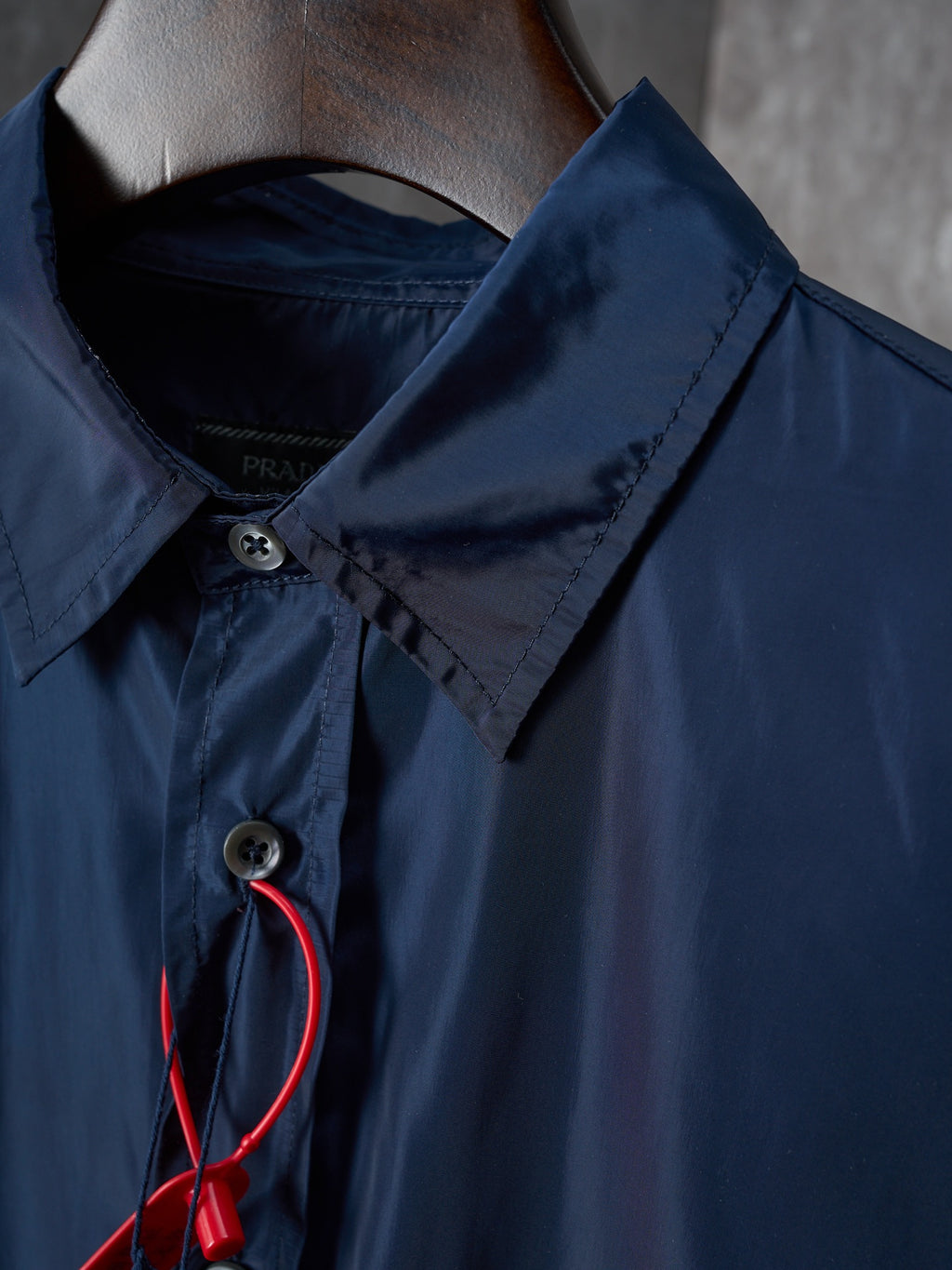 Navy Prada shirt collar with snap button and keyhole placket, red cord detail