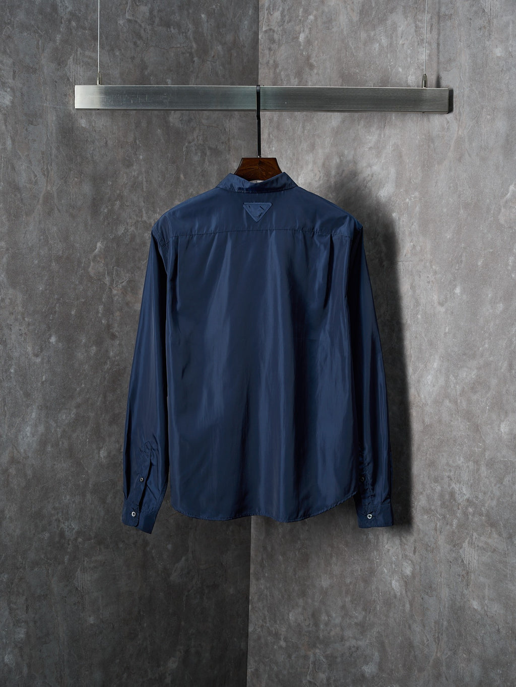 Navy Prada long-sleeve shirt viewed from back with button details and collar