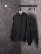 Black Dior long-sleeve hoodie with hood, drawstrings, and front kangaroo pocket