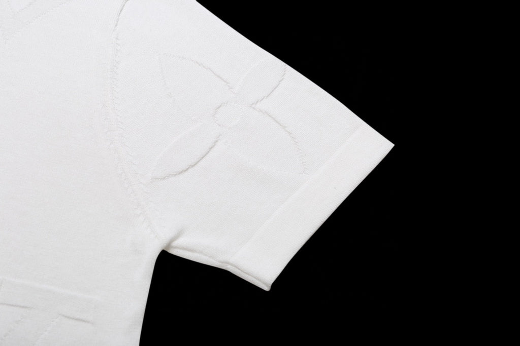 White T-shirt sleeve with subtle monogram embossing