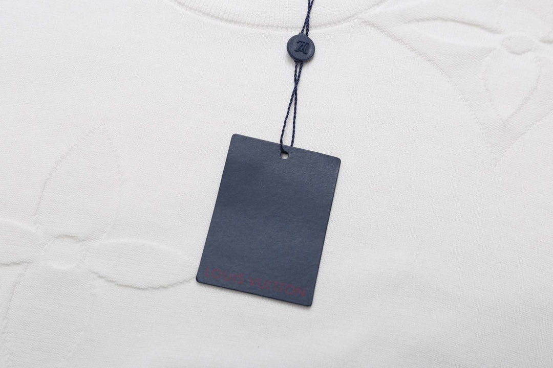 White Louis Vuitton T-shirt with blue hanging tag and crew neckline