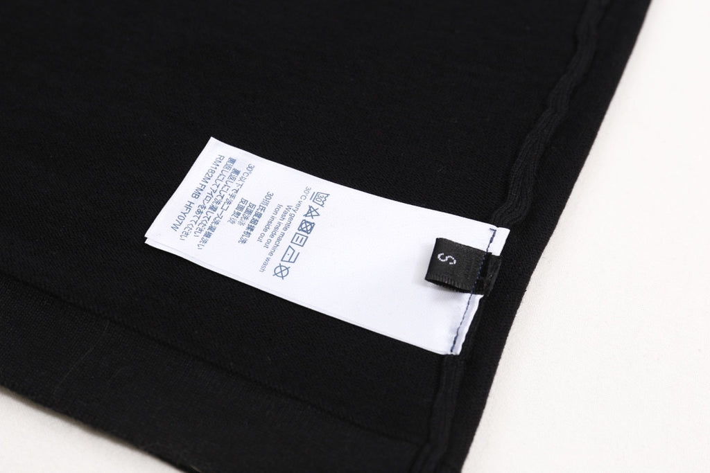Black T-shirt interior label near side seam