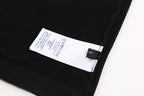 Black T-shirt interior label near side seam